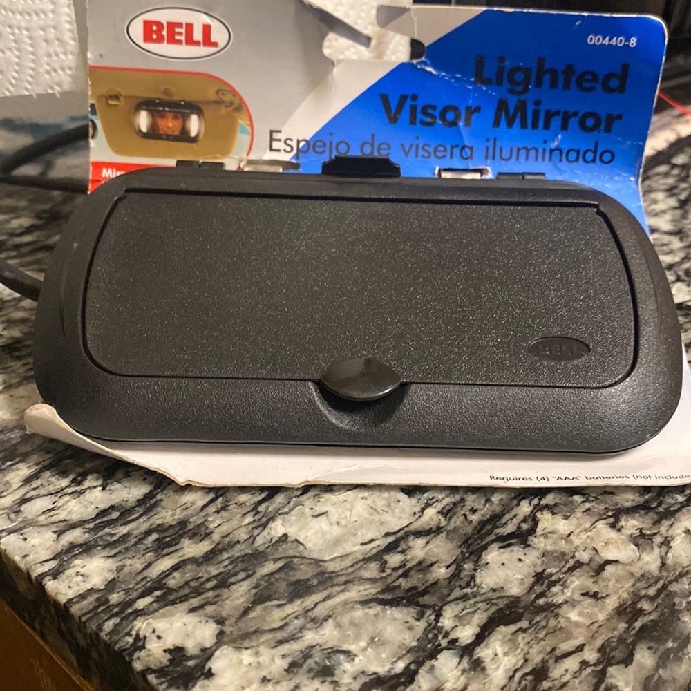 Bell Lighted visor mirror.Mirror lights when cover is opened.
